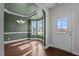Open-concept dining room boasts gleaming hardwood floors, designer lighting, and seamless entry at 130 Hilldebrant Dr, Franklinton, NC 27525