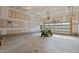 Garage with roll-up door, lawn tractor and unfinished drywall at 130 Hilldebrant Dr, Franklinton, NC 27525