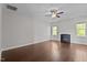 Living room with hardwood floors, fireplace, ceiling fan and large windows at 130 Hilldebrant Dr, Franklinton, NC 27525