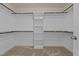 Spacious walk-in closet with ample shelving and multiple rods for optimal organization at 130 Hilldebrant Dr, Franklinton, NC 27525