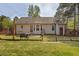 A cozy backyard featuring a well-kept lawn, fence and a lovely patio area perfect for outdoor relaxation at 14 Shire Ct, Zebulon, NC 27597