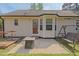 A cozy backyard patio with a swing and outdoor furniture, perfect for relaxation and entertaining at 14 Shire Ct, Zebulon, NC 27597