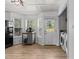 Eat-in kitchen area with natural light, laminate flooring, and a laundry closet at 14 Shire Ct, Zebulon, NC 27597
