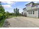 A concrete basketball court in the backyard with a basketball hoop, great for recreational activities at 1429 Wragby Ln, Apex, NC 27502