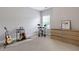Bright bedroom with musical instruments and a dresser, offering a creative and functional space at 1429 Wragby Ln, Apex, NC 27502