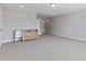 Spacious bonus room featuring neutral carpet, plenty of space and modern cabinetry at 1429 Wragby Ln, Apex, NC 27502