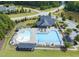 Aerial view showcasing a community pool with a splash pad, leisure area and seating at 1429 Wragby Ln, Apex, NC 27502