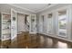 Bright living room with hardwood floors, french doors, and staircase access at 1429 Wragby Ln, Apex, NC 27502