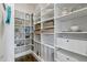 Organized pantry with custom shelving, storage baskets, and drawers for optimal storage at 1429 Wragby Ln, Apex, NC 27502