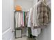 Well-organized walk-in closet with ample hanging space, shelving, and room for luggage and accessories at 1429 Wragby Ln, Apex, NC 27502