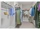 Spacious walk-in closet with ample hanging space and shelving for organized storage of clothing and accessories at 1429 Wragby Ln, Apex, NC 27502