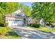 Charming single-Gathering home boasting a manicured lawn, a two-car garage, and stone accents at 146 Rockport Ridge Way, Cary, NC 27519