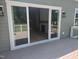 View of deck with open sliding glass doors providing seamless indoor-outdoor flow, and a glimpse of the living room fireplace at 15 Independence Dr, Smithfield, NC 27577