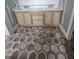Bathroom with double vanity and beautiful brown, cream, and beige decorative tile flooring at 15 Independence Dr, Smithfield, NC 27577