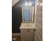 Chic powder room features a dark accent wall and bright modern vanity at 15 Independence Dr, Smithfield, NC 27577