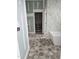 Elegant bathroom with freestanding tub, closet and beautiful tile flooring at 15 Independence Dr, Smithfield, NC 27577