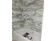 Modern bathroom features marble tile, a built-in shower niche, and a soaking tub at 15 Independence Dr, Smithfield, NC 27577