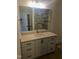 Bathroom with a white vanity, modern fixtures, and a beautifully tiled shower stall at 15 Independence Dr, Smithfield, NC 27577