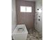 Bathroom featuring a free-standing tub, shower with bronze fixtures, decorative tile and window at 15 Independence Dr, Smithfield, NC 27577