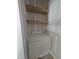 Charming bathroom featuring a granite-topped vanity with floating wood shelves at 15 Independence Dr, Smithfield, NC 27577