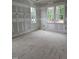 Large bedroom with three windows providing natural light under construction at 15 Independence Dr, Smithfield, NC 27577
