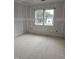 A new bedroom with windows is ready for finishing with drywall and primer at 15 Independence Dr, Smithfield, NC 27577