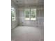 A bright and airy bedroom with large windows offering scenic views at 15 Independence Dr, Smithfield, NC 27577