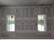 A bedroom with views from the windows and decorative window trim at 15 Independence Dr, Smithfield, NC 27577