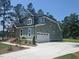 Side view of an attractive home showing the garage, neat landscaping, and clean architectural lines at 15 Independence Dr, Smithfield, NC 27577