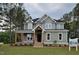 Charming two-story home with a welcoming porch and beautifully landscaped front yard at 15 Independence Dr, Smithfield, NC 27577