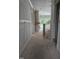 Spacious hallway leading to a fireplace and staircase with modern railings at 15 Independence Dr, Smithfield, NC 27577