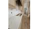 Close-up of kitchen counter featuring beautiful marble countertops and custom wood cabinets at 15 Independence Dr, Smithfield, NC 27577