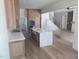 Well-designed kitchen with custom cabinets, a large island with white countertop, and modern appliances at 15 Independence Dr, Smithfield, NC 27577