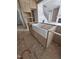 Unfinished kitchen featuring an island with a farmhouse sink and an unfinished wood cabinet at 15 Independence Dr, Smithfield, NC 27577