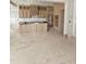 Unfinished kitchen boasting custom wooden cabinets and a center island with vertical wood slat detailing at 15 Independence Dr, Smithfield, NC 27577