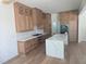 Stylish kitchen featuring custom wood cabinets, white countertops, and modern stainless steel appliances at 15 Independence Dr, Smithfield, NC 27577