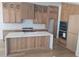 Gourmet kitchen featuring light wood cabinets, a spacious island, and stainless appliances at 15 Independence Dr, Smithfield, NC 27577