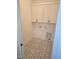 This laundry room has decorative tile flooring and white overhead cabinets at 15 Independence Dr, Smithfield, NC 27577