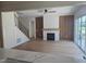 Living room showcases hardwood floors, fireplace, wood accents and lots of light at 15 Independence Dr, Smithfield, NC 27577