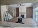 Open living room featuring hardwood floors, custom wood paneling and fireplace at 15 Independence Dr, Smithfield, NC 27577