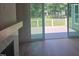 View from deck into a living room space, featuring a fireplace and view to the backyard at 15 Independence Dr, Smithfield, NC 27577