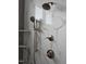 This modern shower features bronze fixtures, marble-look tiles, and a convenient hand shower at 15 Independence Dr, Smithfield, NC 27577