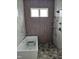 Sleek shower with rainfall showerhead, handheld wand, and stylish marble tiles at 15 Independence Dr, Smithfield, NC 27577
