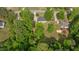 A high-angle aerial shot of the property and its landscaped surroundings at 160 Fox Run Rd, Youngsville, NC 27596