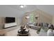 Finished attic area with neutral walls and carpeted flooring at 160 Fox Run Rd, Youngsville, NC 27596