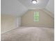 Spacious attic space with neutral walls and carpeted flooring at 160 Fox Run Rd, Youngsville, NC 27596