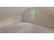 Attic space with neutral walls and carpeted flooring at 160 Fox Run Rd, Youngsville, NC 27596
