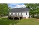 Backyard deck with wooden railings, perfect for outdoor entertaining and relaxation at 160 Fox Run Rd, Youngsville, NC 27596