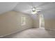 Bright bedroom with a ceiling fan and natural light from two windows at 160 Fox Run Rd, Youngsville, NC 27596