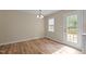 Cozy dining area with natural light and hardwood flooring at 160 Fox Run Rd, Youngsville, NC 27596